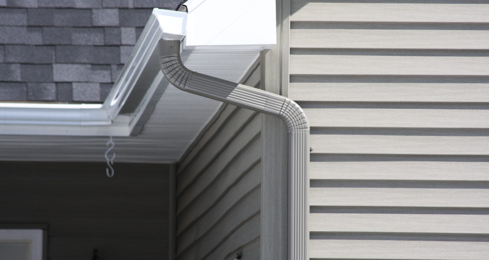 Silver Gutters Attached to Residential Property